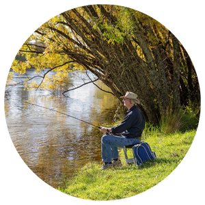 retiree fishing by a lake 